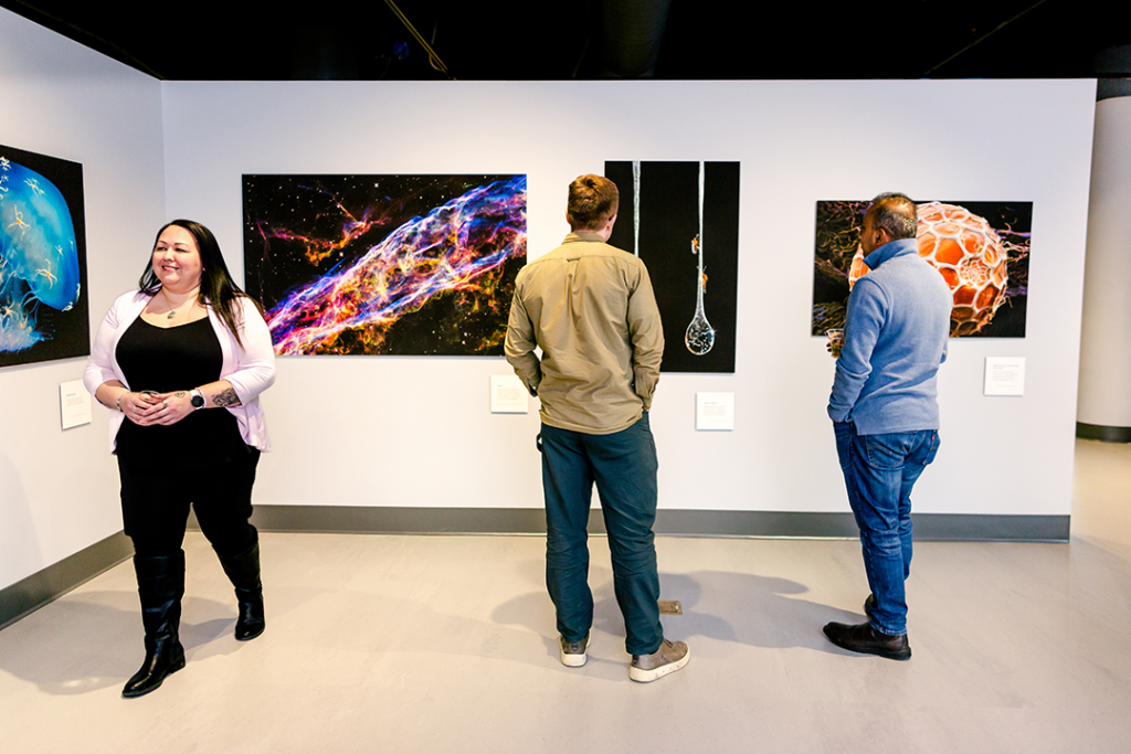 Visitors viewing photography at Spectacle: Rare and Astonishing Photos.