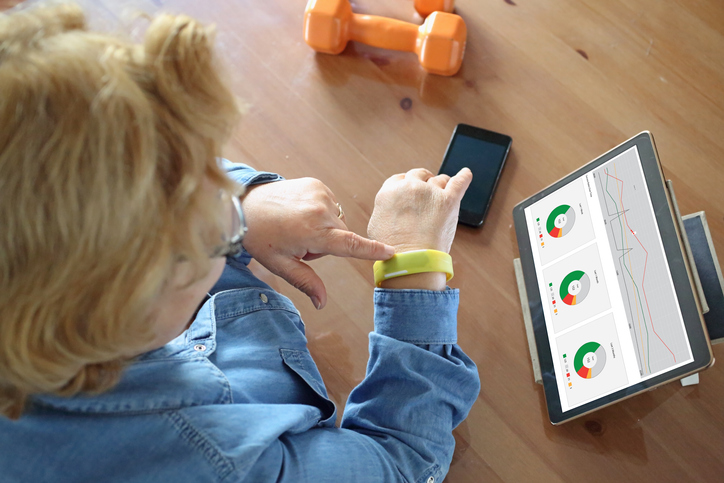 woman wearing health and fitness monitor